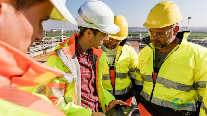 AQD--engineers-and-workers-assesing-wastewater-plant-700x394pc